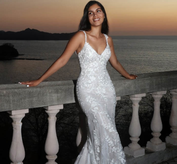 Model wearing a white gown by DaVinci